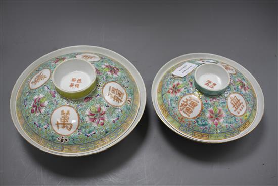 Two graduated Chinese famille rose bowls and cover, 20th century, each decorated with inscriptions and bearing red four character marks